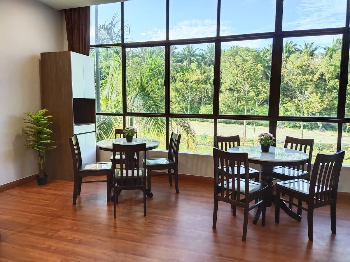 A bright communal dining and visiting area at a Genesis Life Care centre
