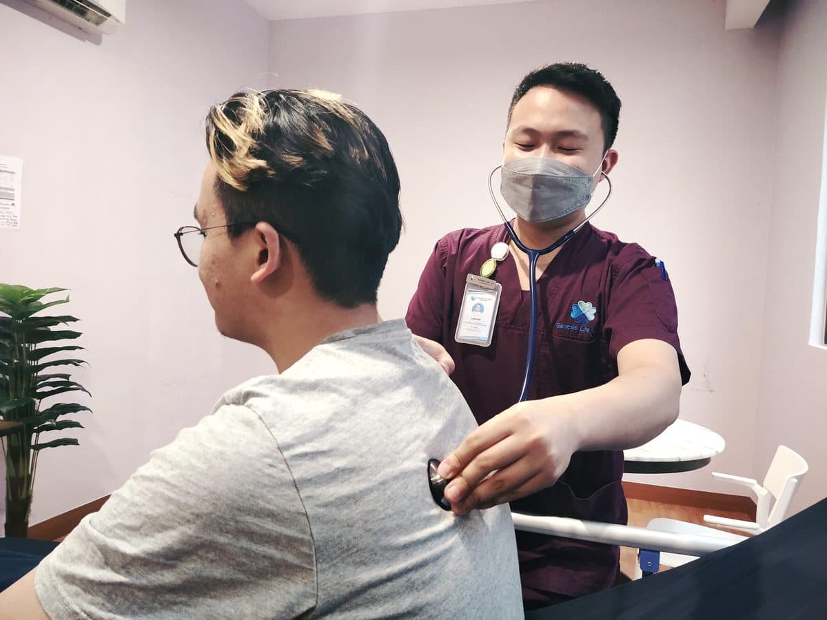 A Genesis Life Care nurse performing a clinical assessment on a resident