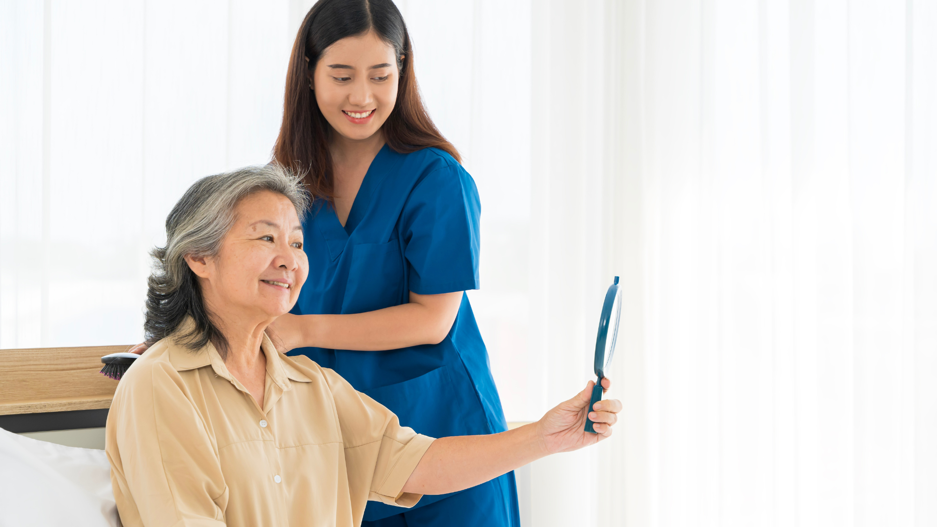 Comprehensive medical care — caregiver assisting elderly resident at Genesis Life Care